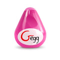 A glossy pink teardrop-shaped gvibe gegg masturbator with a white oval label featuring the gegg logo in red and black script