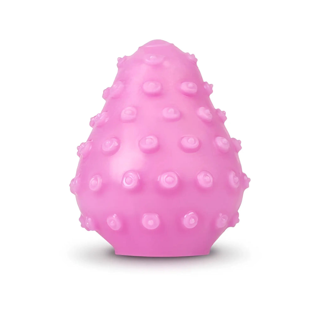 Gvibe GEgg masturbator in pink silicone with raised rounded bumps across its egg-shaped surface