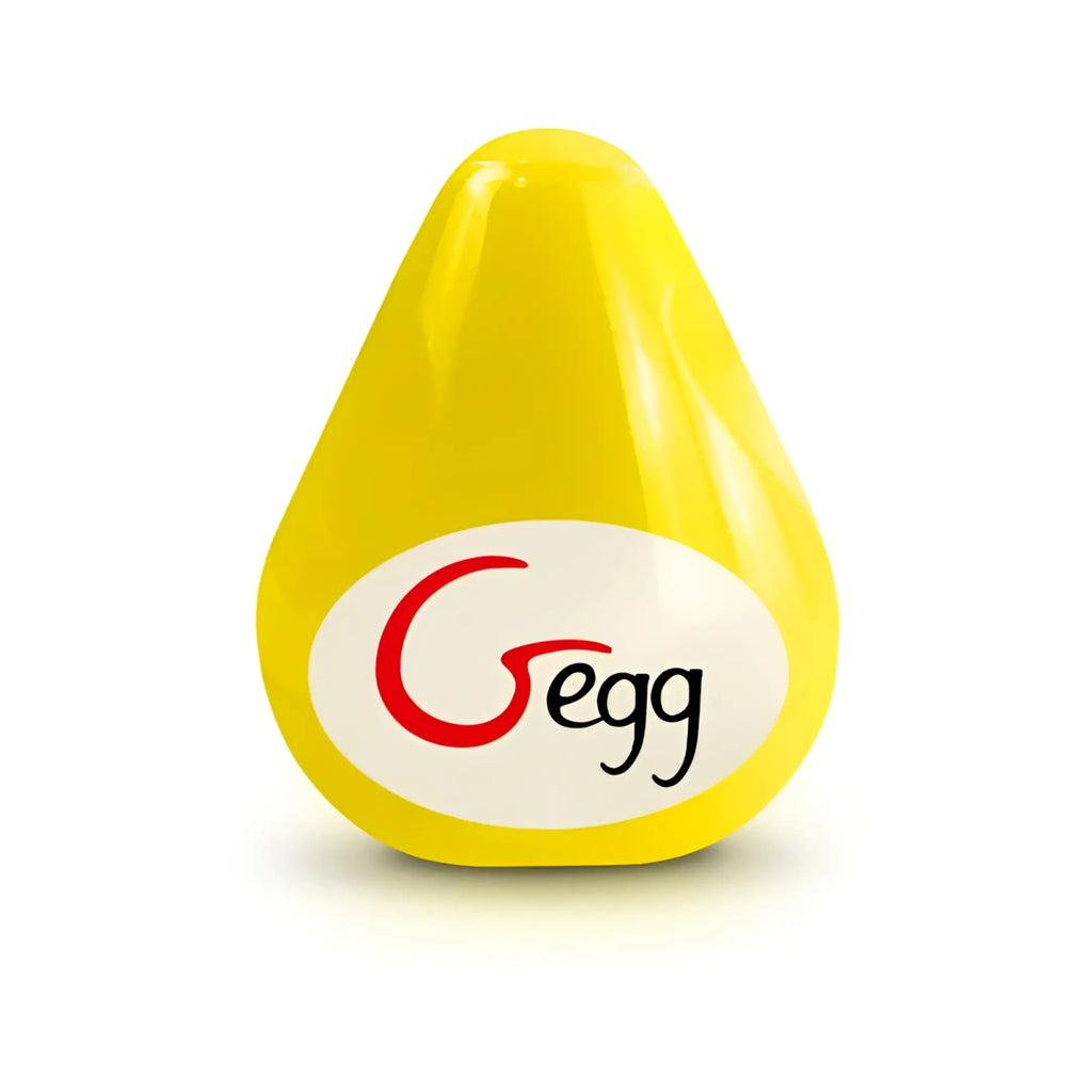 A bright yellow teardrop-shaped plastic gvibe gegn masturbator with a white oval label and red and black logo