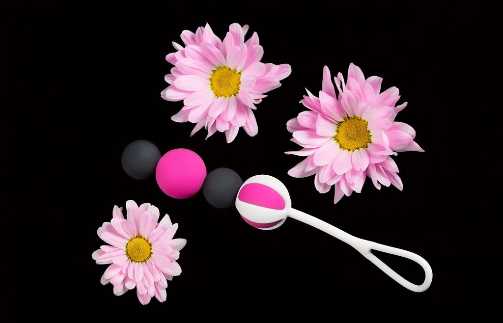 Pink and white silicone gvibe geisha balls magnetic baby rattle with black beads designed for gentle play
