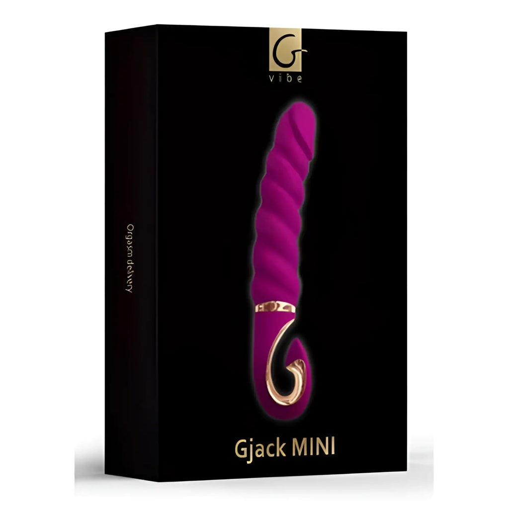 Vibrant magenta gvibe gjack mini vibrator with textured spiral design and gold-toned metallic accents in sweet raspberry