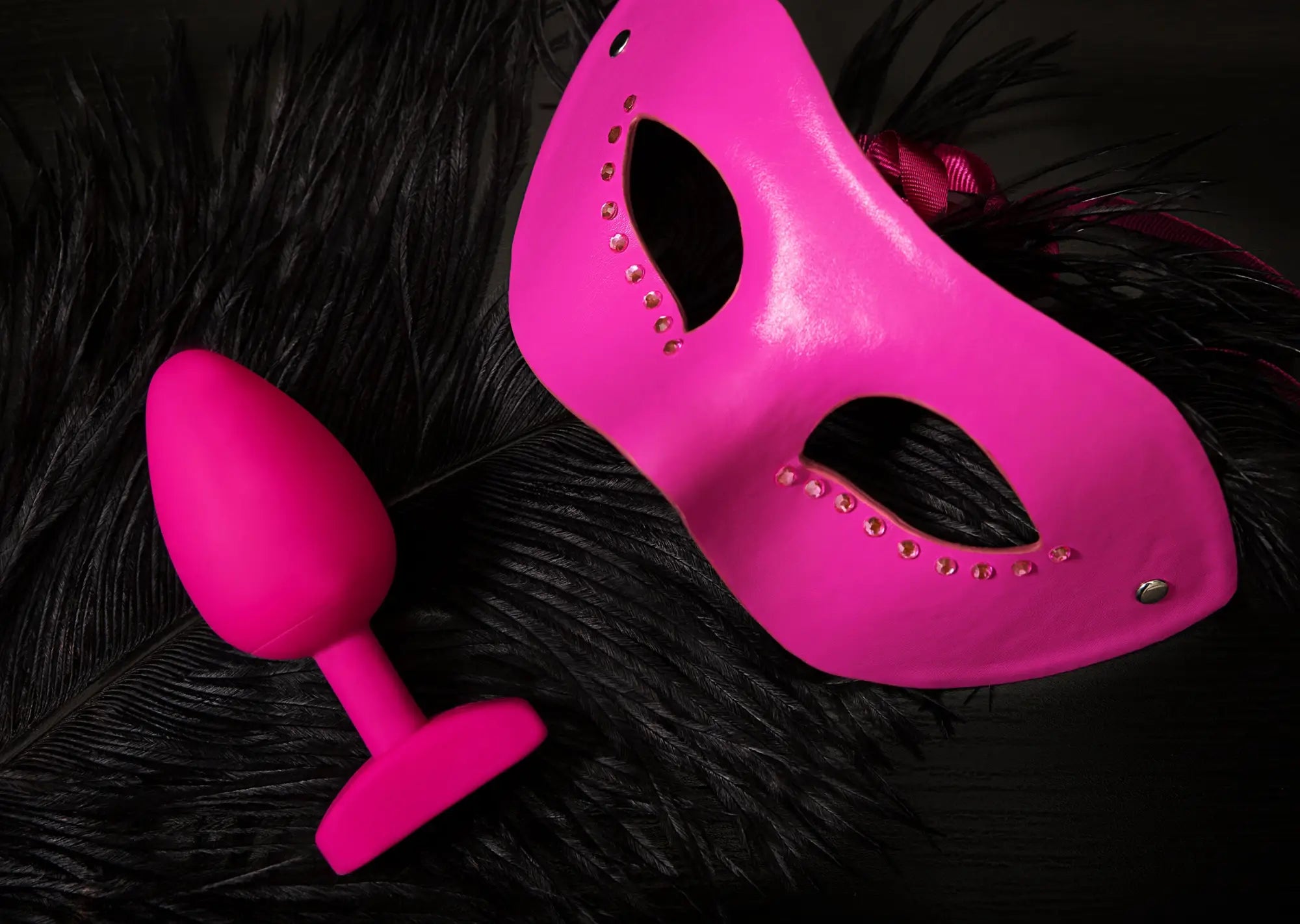 Vibrant pink leather mask with rhinestones and matching pink silicone gvibe gplug large bioskin sweet raspberry plug