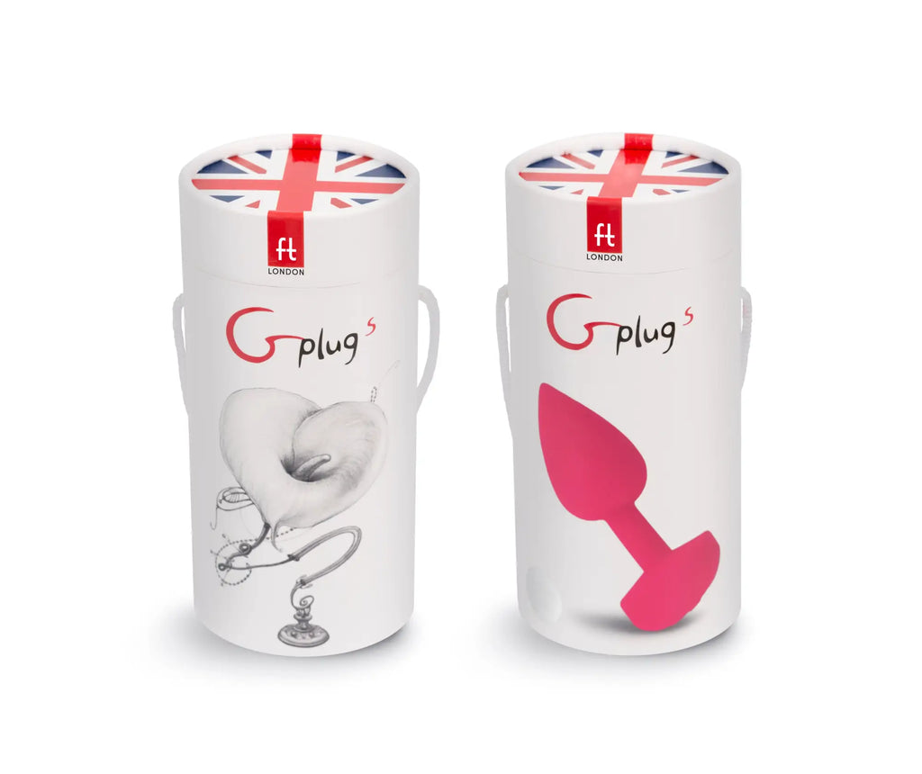 Pink silicone g plug displayed in a white cylindrical box with union jack design for discreet pleasure use