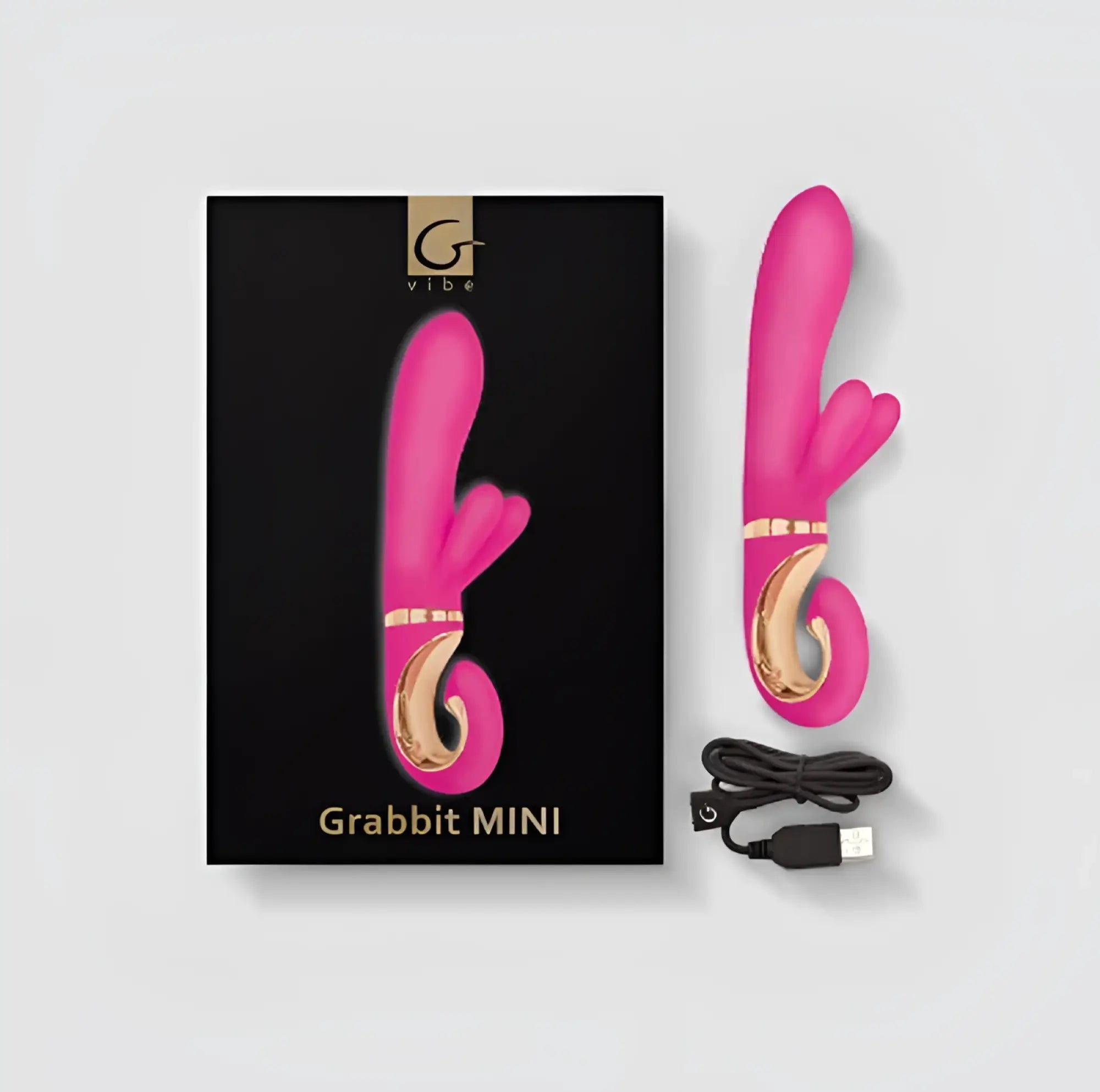 Pink Gvibe Grabbit MINI Dolce Violet vibrator with gold accents and a usb charging cable for discreet pleasure