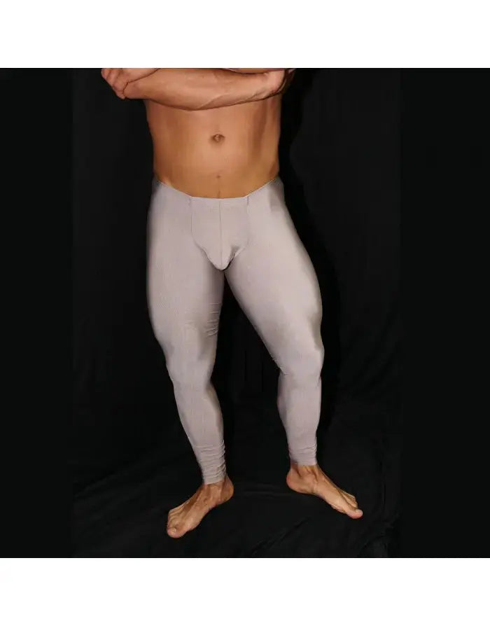 Caramel gym tights by Arroyman featuring a snug fit ribbed texture and a bulge-enhancing design shown on a model.