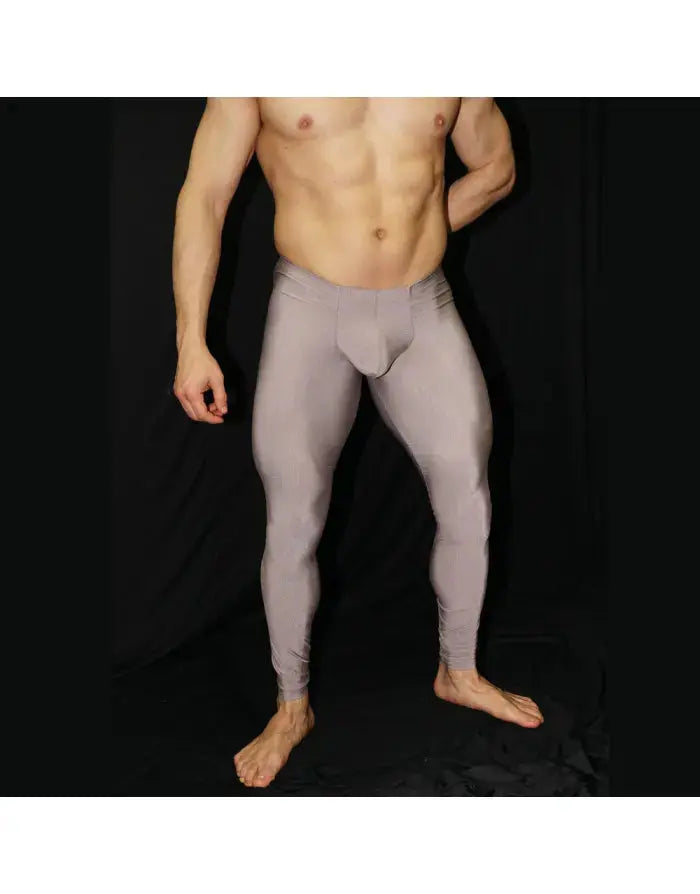 Caramel gym tights by Arroyman featuring a snug fit stretchy material and a smooth texture shown on a model.