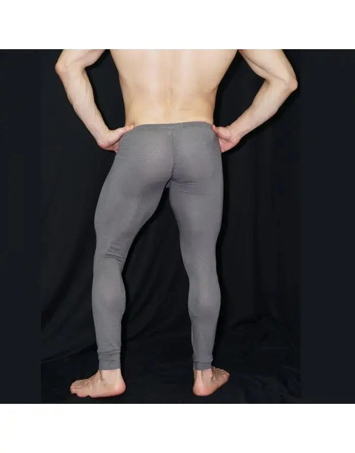 Men's grey mesh gym tights by Arroyman featuring a snug fit and breathable material shown from the back.