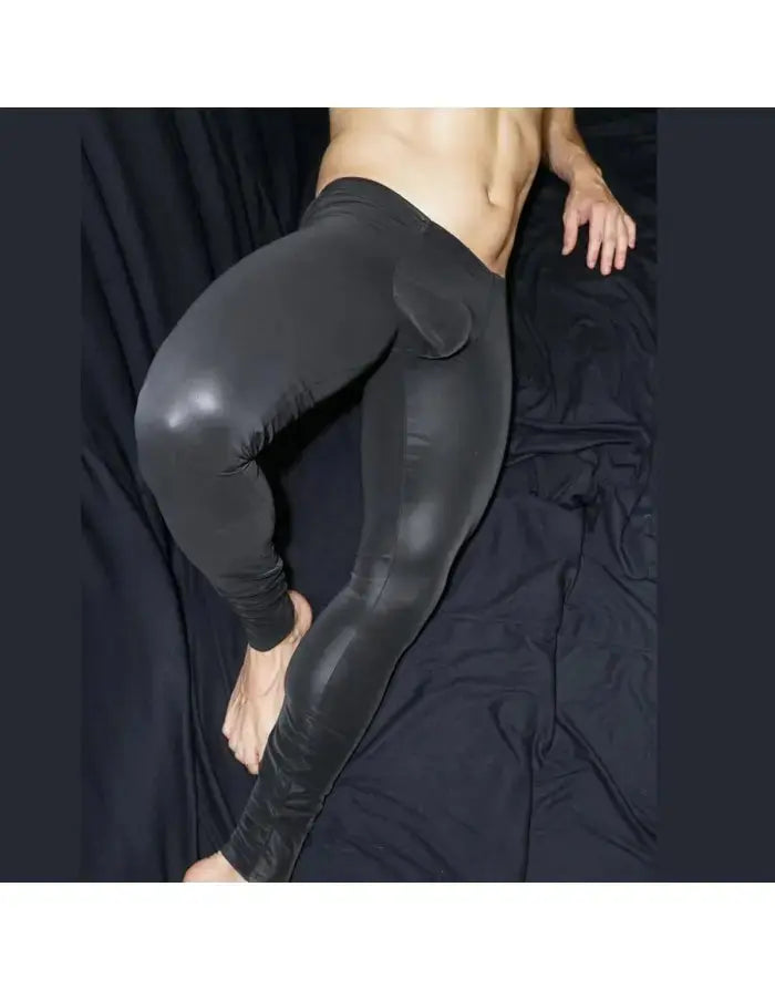 Black eco leather runner tights by Arroyman featuring a fitted design and smooth texture shown on a model.