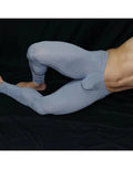 Light blue men's gym tights with a fitted design featuring a bulge pouch shown on a model by Arroyman.