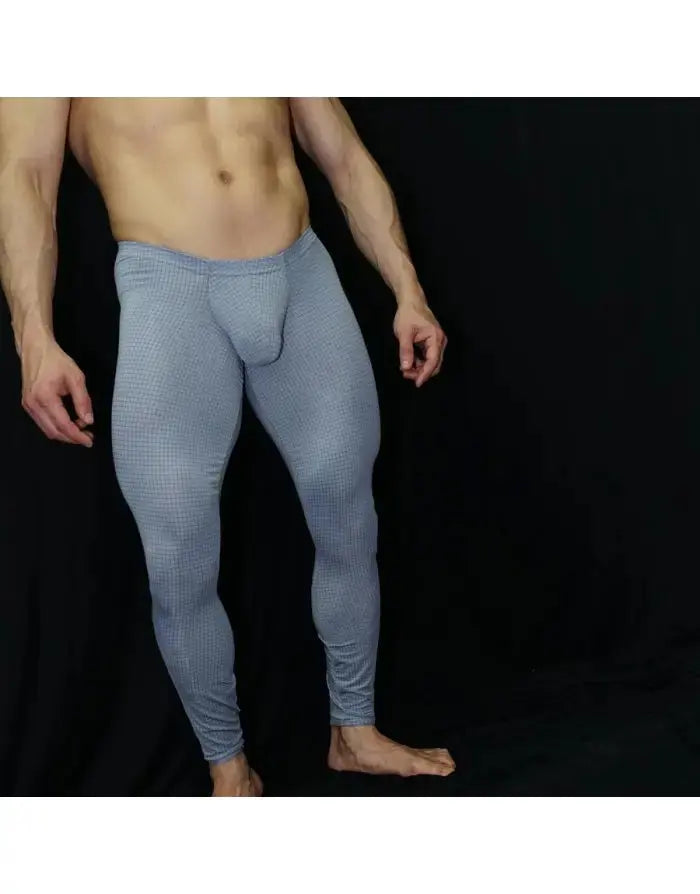 Men's fitted gym tights in light blue with a checkered pattern made by Arroyman featuring a supportive design.
