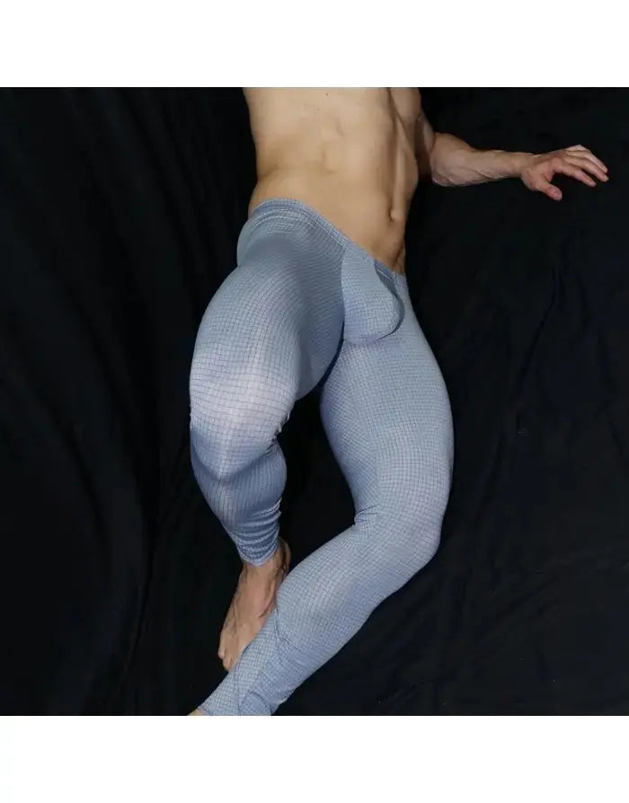 Light blue checkered men's gym tights by Arroyman featuring a snug fit and supportive design shown on a model.