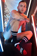 Gymnetixxx crew socks in black with white stripes red accents and fight end text for gym and casual wear