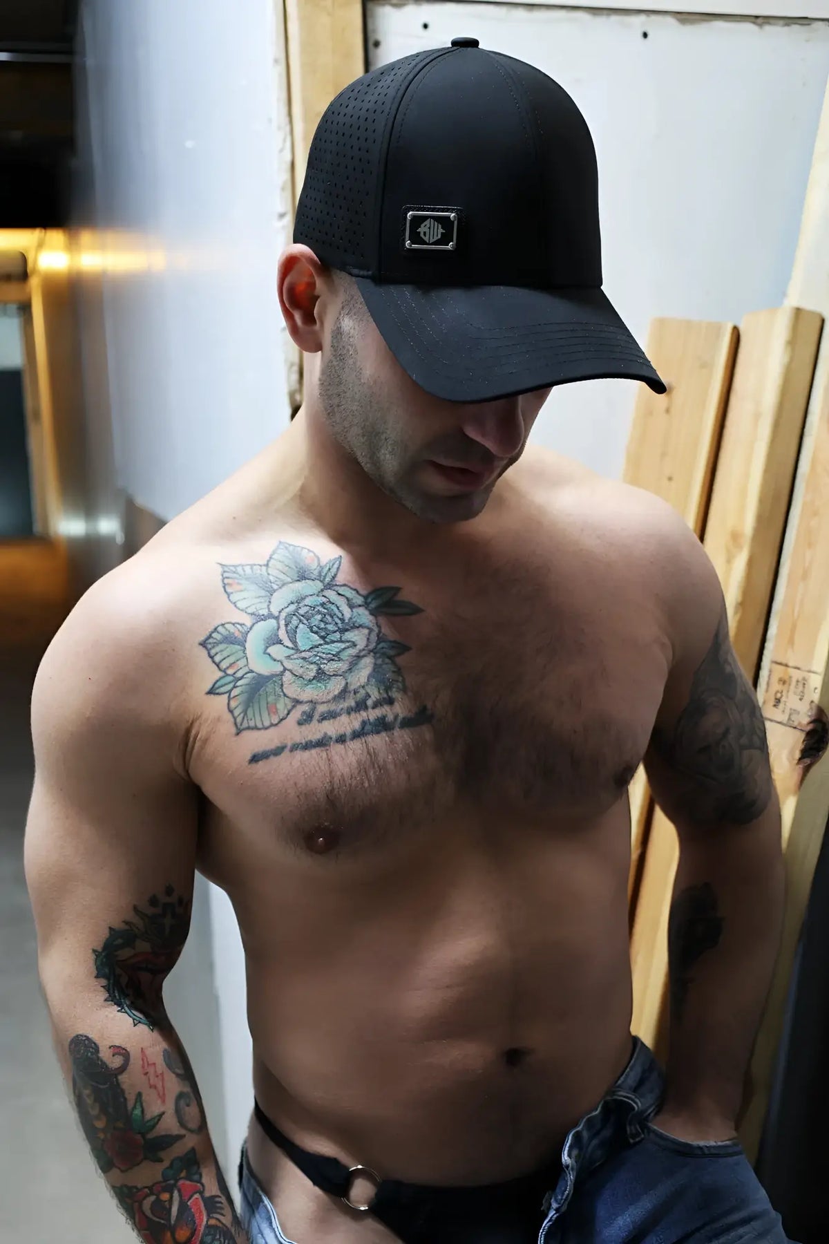 Black mesh baseball cap gymnetixxx hat with small rectangular logo on the front for casual or gym wear