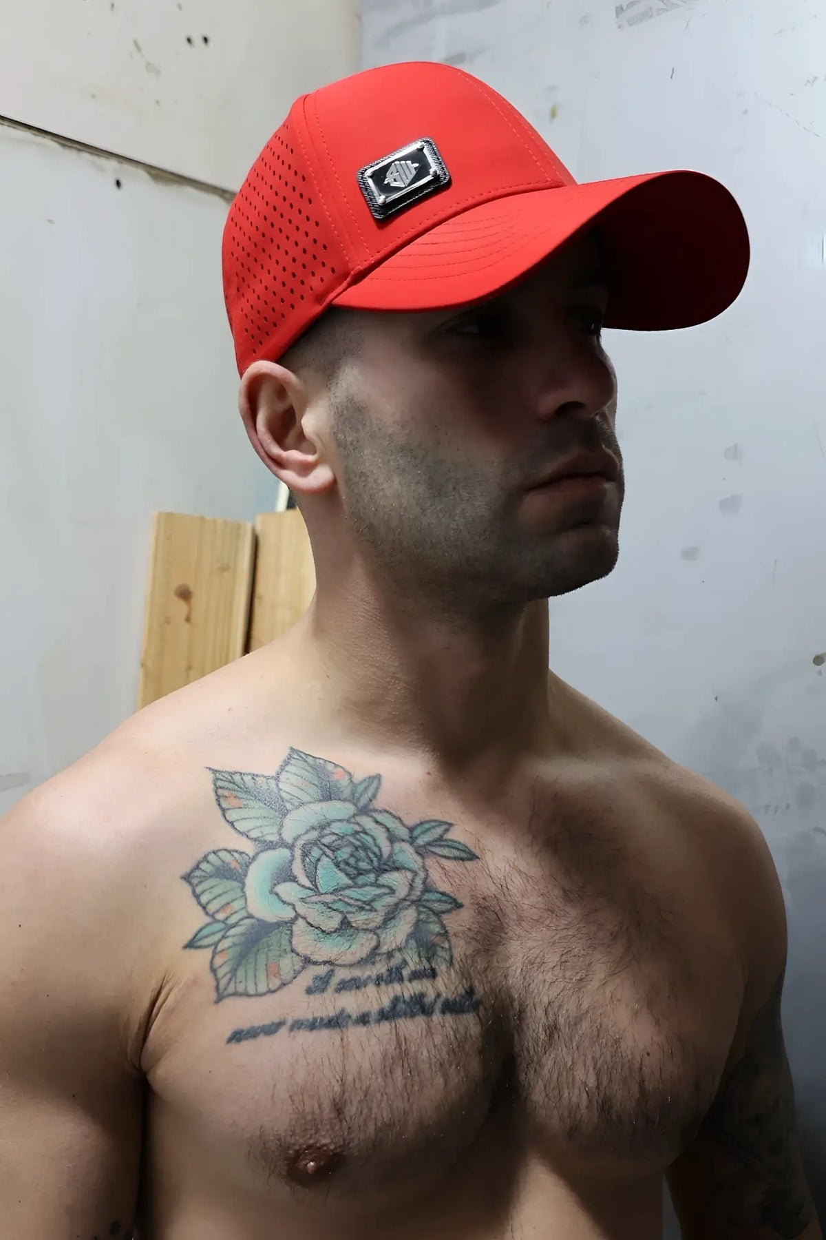 Red mesh baseball cap with black rectangular logo patch on the front from Gymnetixxx hat collection
