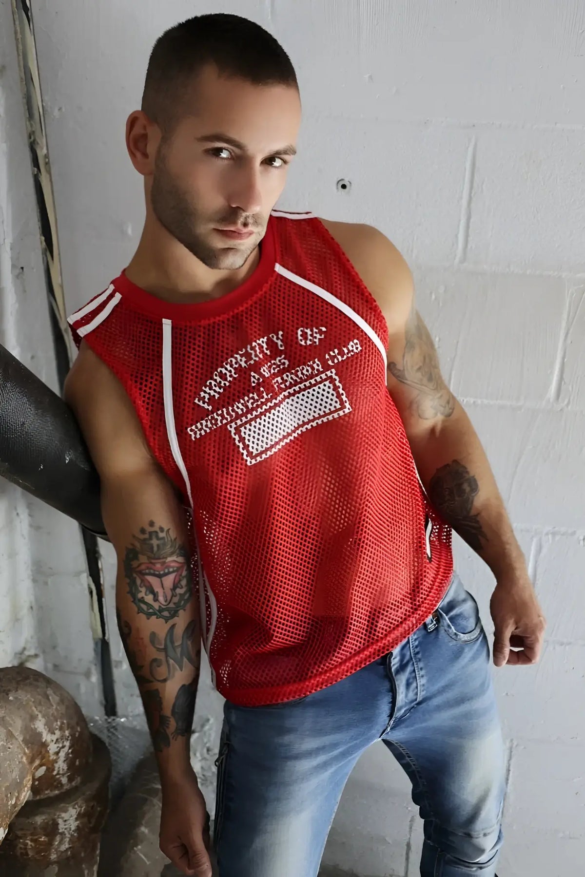 Red mesh tank top with white trim and embroidered property of s text from gymnetixxx jersey collection