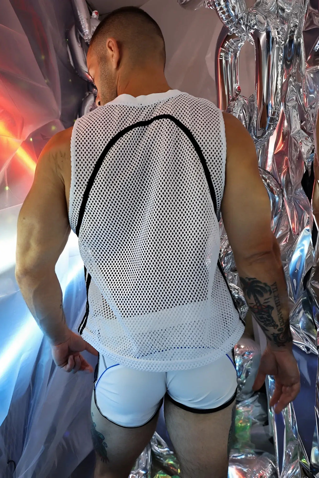 White mesh tank top with black trim from gymnetixxx jersey designed for breathable gym wear
