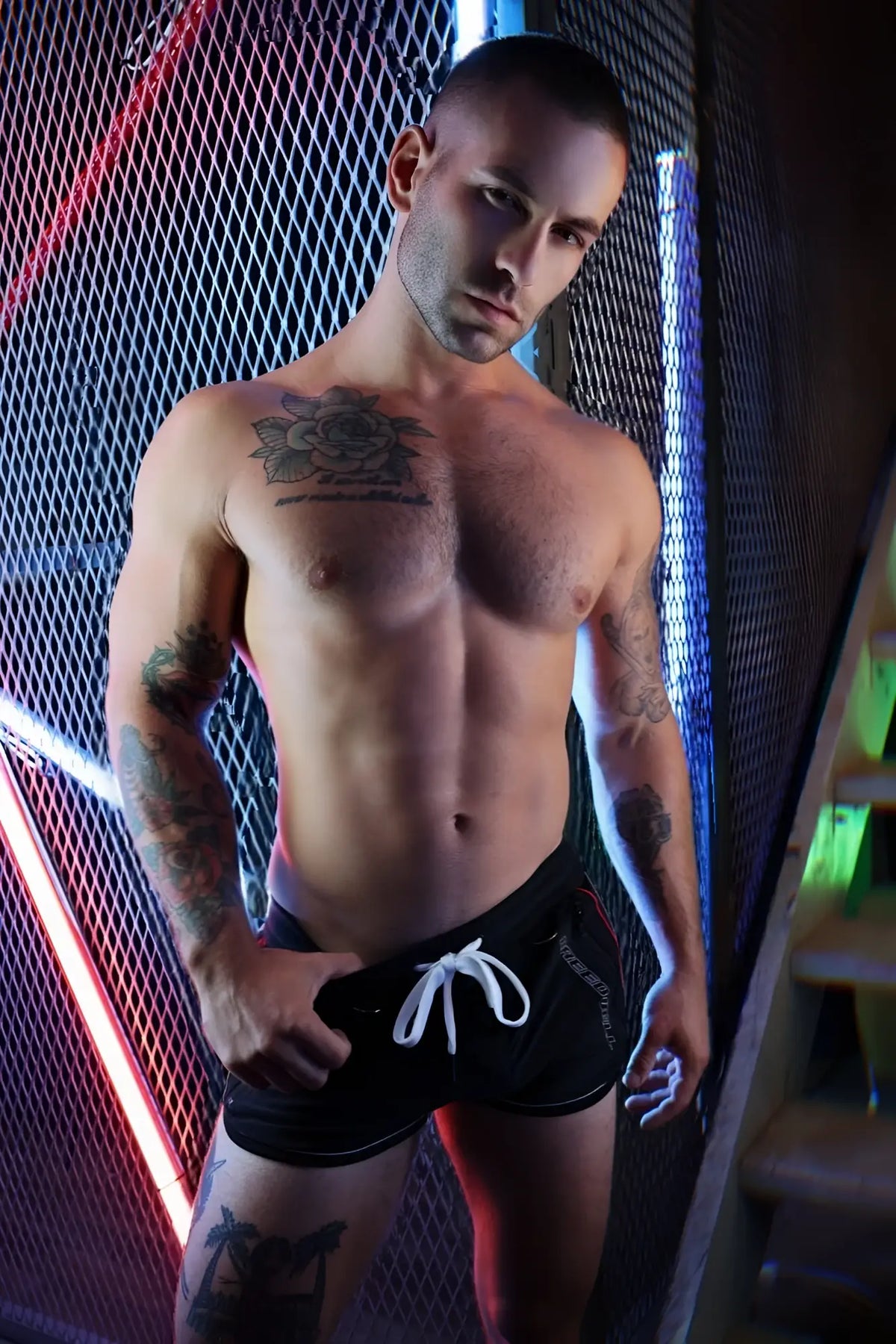 Black Gymnetixxx swim trunks with white drawstring and subtle side branding ideal for gym and casual wear