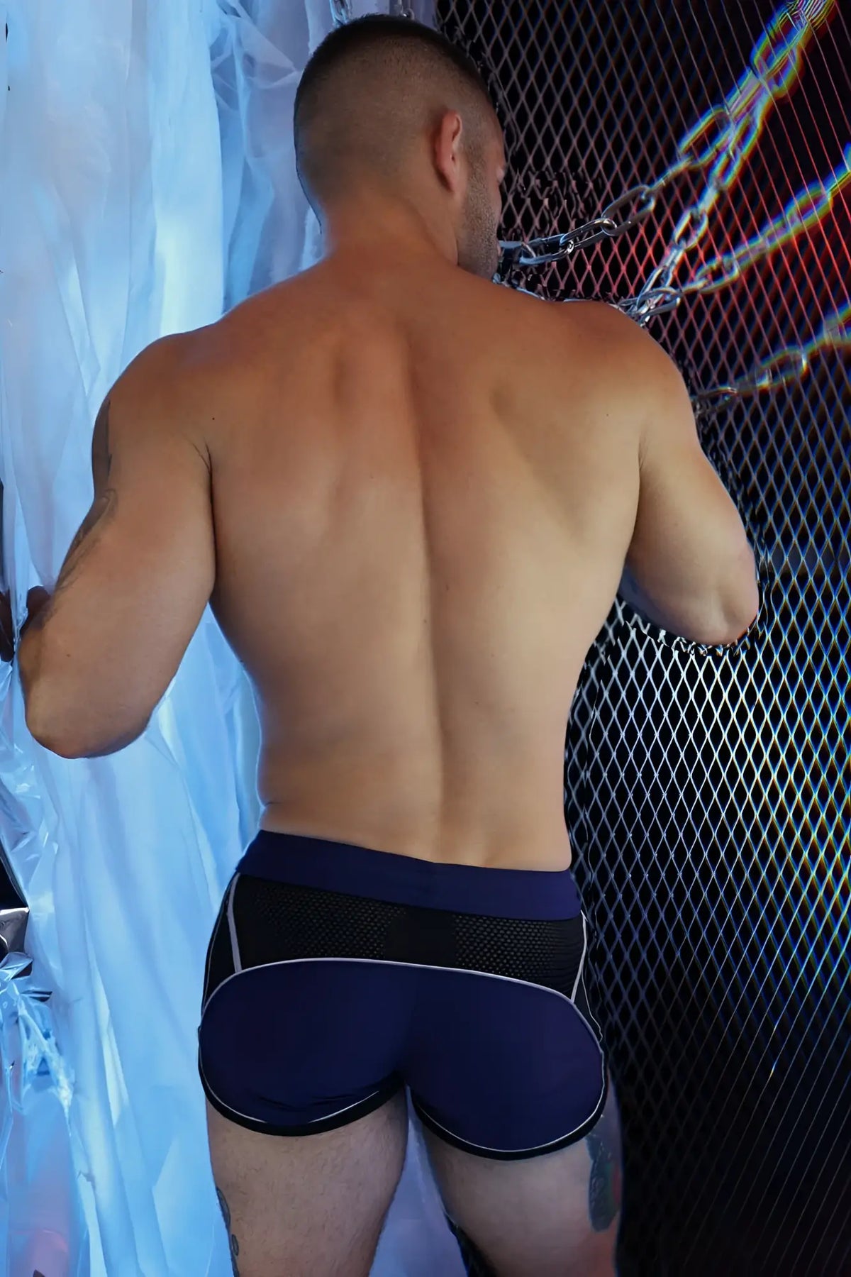 Navy blue and black Gymnetixxx athletic briefs with white trim designed for workout performance