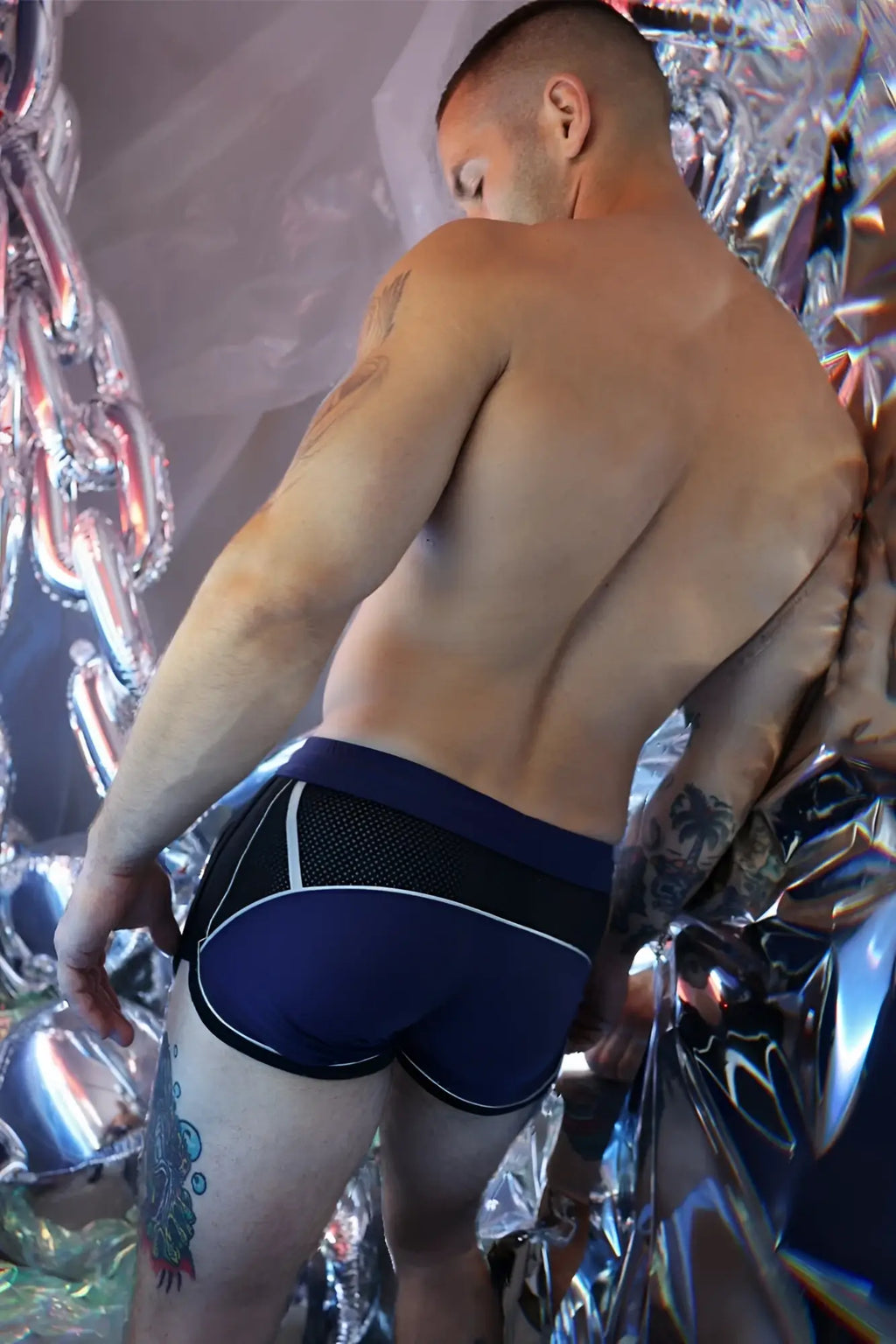 Navy blue and black Gymnetixxx athletic briefs with white trim designed for comfortable gym workouts