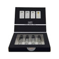 Black rectangular box with four clear glass hot ero pheromone perfume vials labeled london miami and tokyo for men