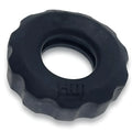 Black textured rubber cockring with scalloped edge and embossed hui branding from hunkyjunk super hunkyjunk set