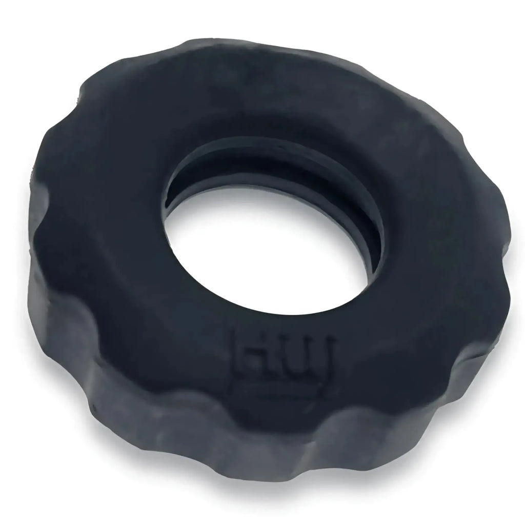 Black textured rubber cockring with scalloped edge and embossed hui branding from hunkyjunk super hunkyjunk set