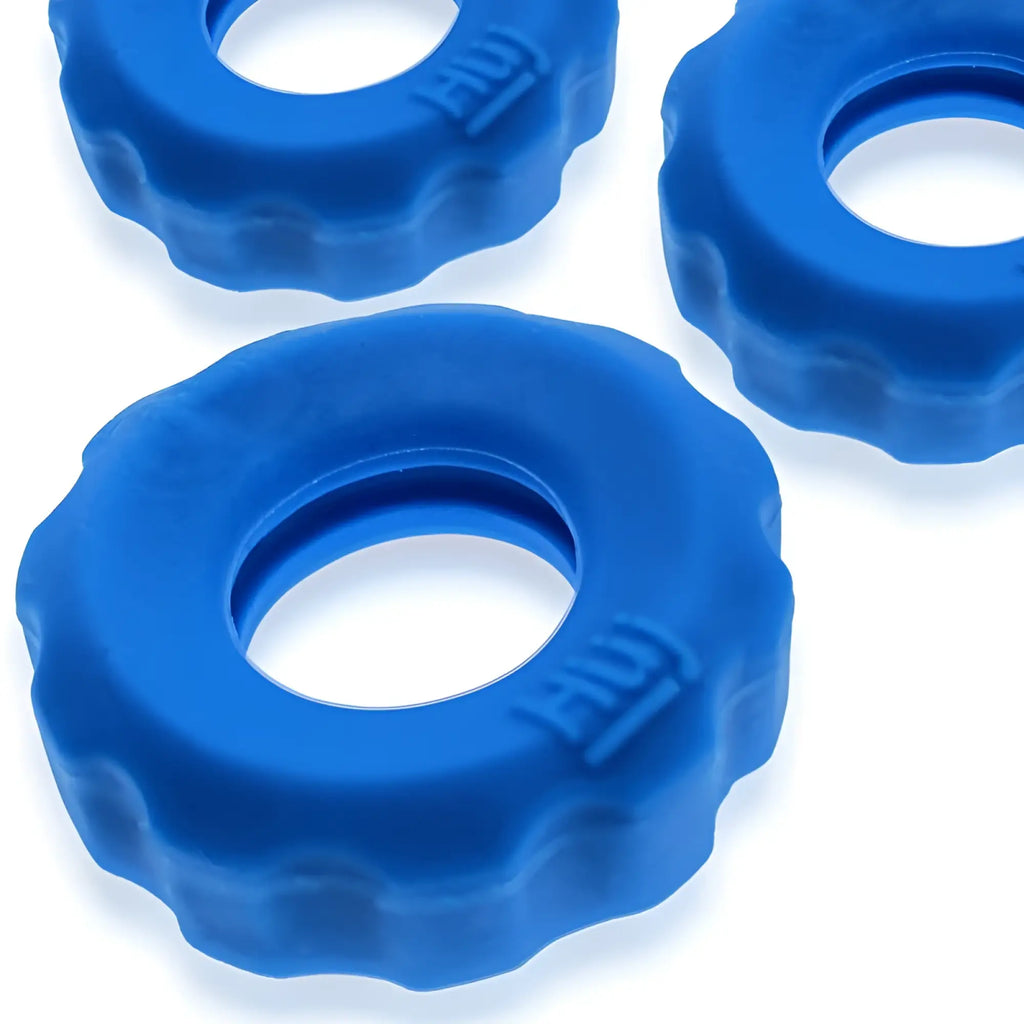 Bright blue textured silicone hunkyjunk super hunkyjunk 3 pc cockrings with scalloped edge and embossed hui branding