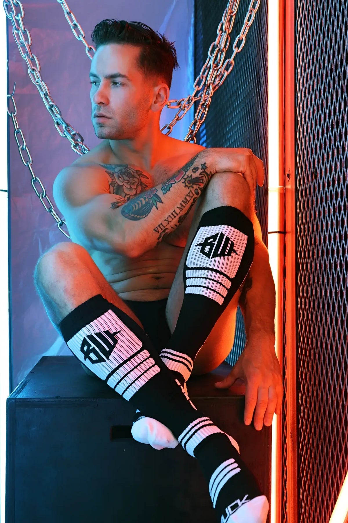 Hypnotix socks black and white striped knee-high socks with bold logo on the calf in cotton blend material
