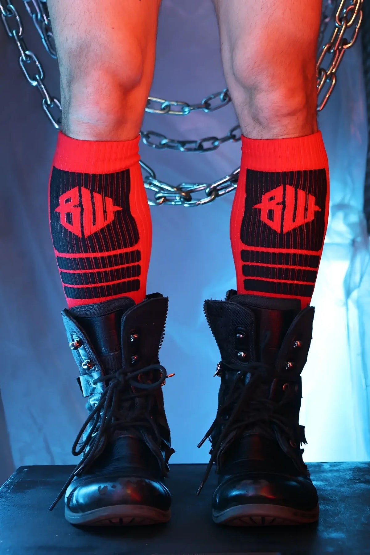 Hypnotix socks red and black athletic socks with bold bw logo and vertical pinstripes and horizontal stripes design