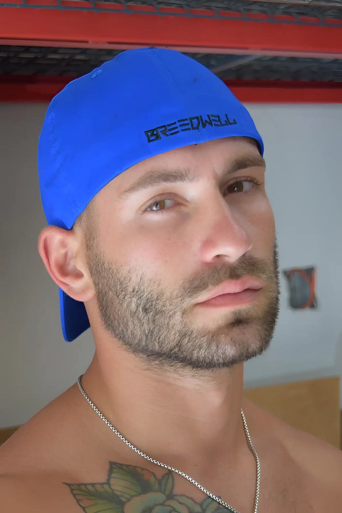 Bright blue icon cap with black embroidered Breedwell logo made of durable fabric for casual wear