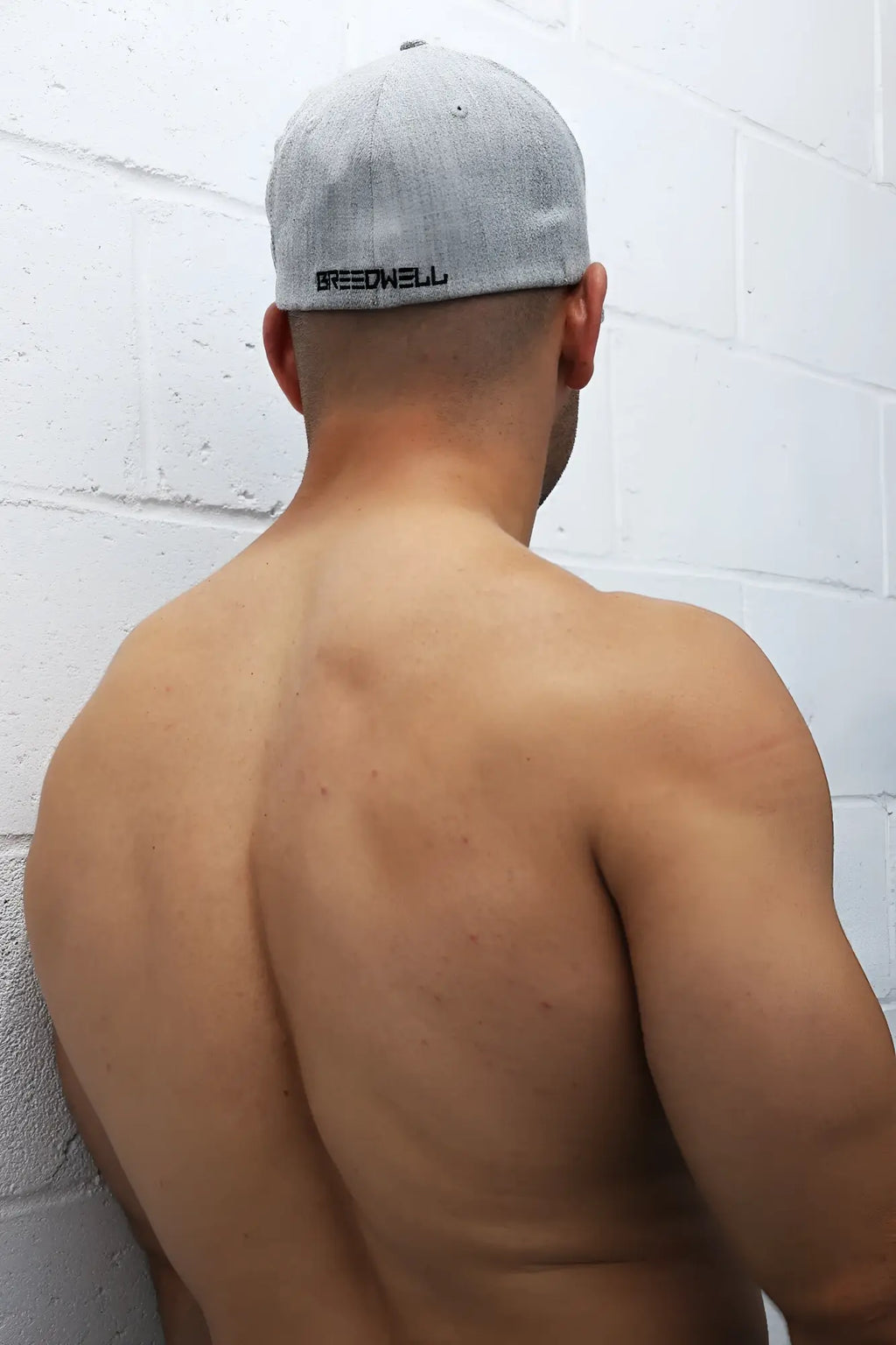 Back view of icon cap grey heather baseball cap with black embroidered speedhill branding on the back