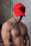 Red baseball cap featuring a black embroidered logo on the front, part of the ICON CAP red collection
