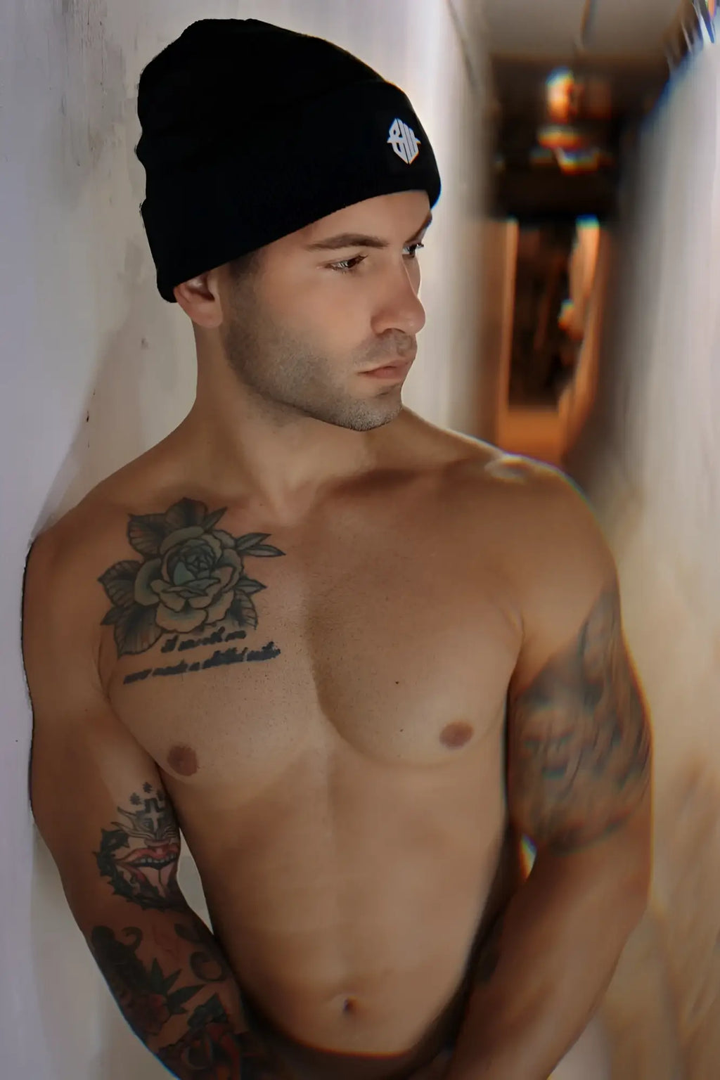 Black Iconixxx beanie with white embroidered logo made of soft knit material for casual cold weather wear