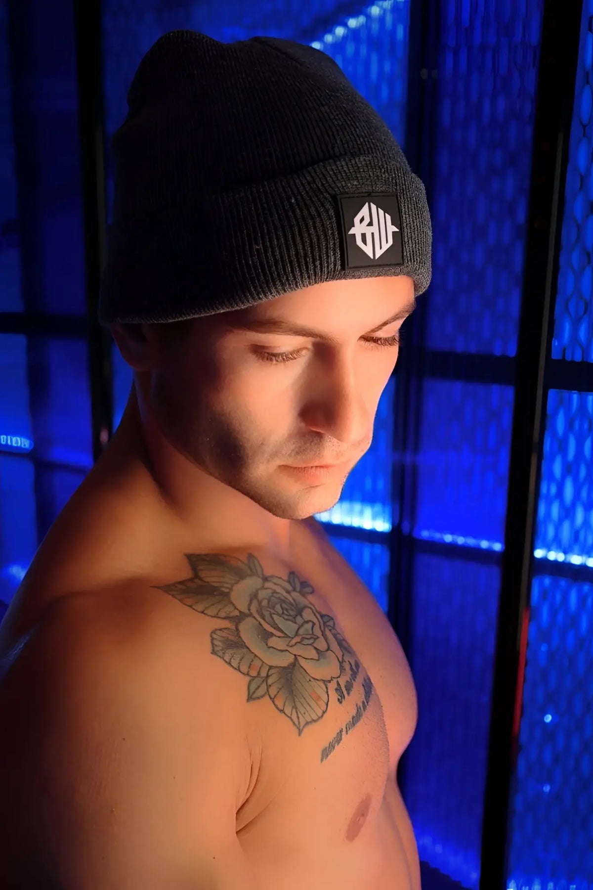 Dark gray knit iconixxx beanie with black patch featuring a white geometric logo on the front