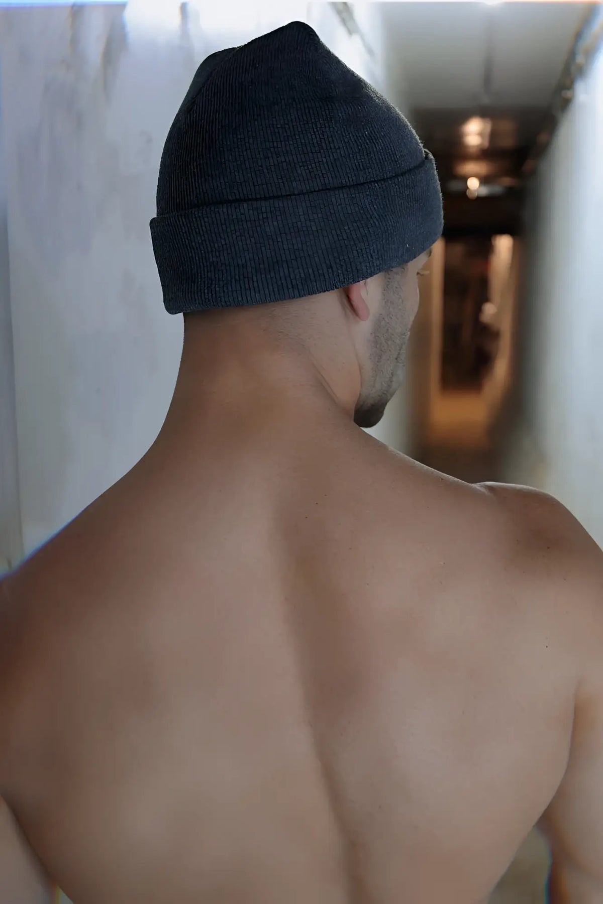 Dark gray knitted beanie with folded cuff made of soft yarn by Iconixxx for cold weather use