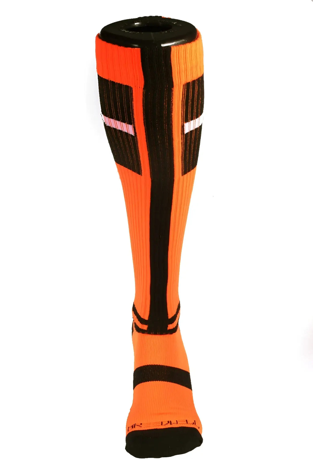 Bright orange infinity socks with black and white geometric stripes made of ribbed knit material for athletic use