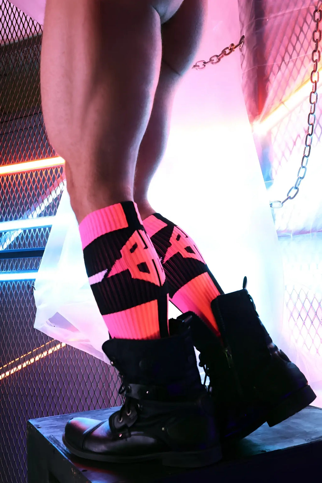 Infinity socks neon pink and black striped knee-high socks with bold geometric logo design in soft fabric