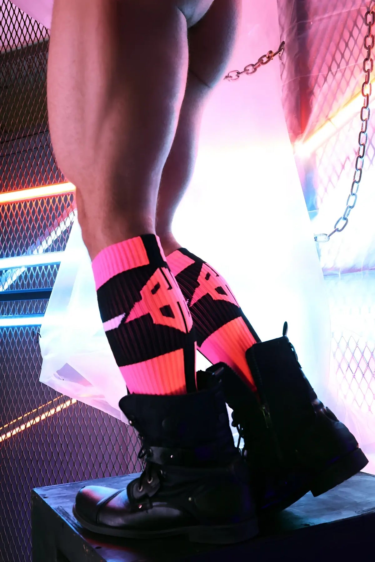 Infinity socks neon pink and black striped knee-high socks with bold geometric logo design in soft fabric