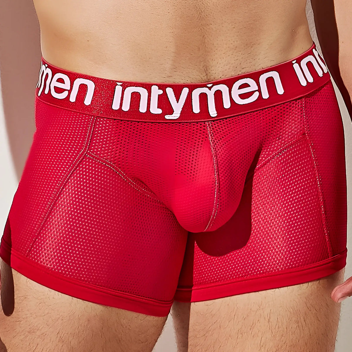 Red mesh boxer briefs with white intymen logo on waistband from the Intymen ING081 collection