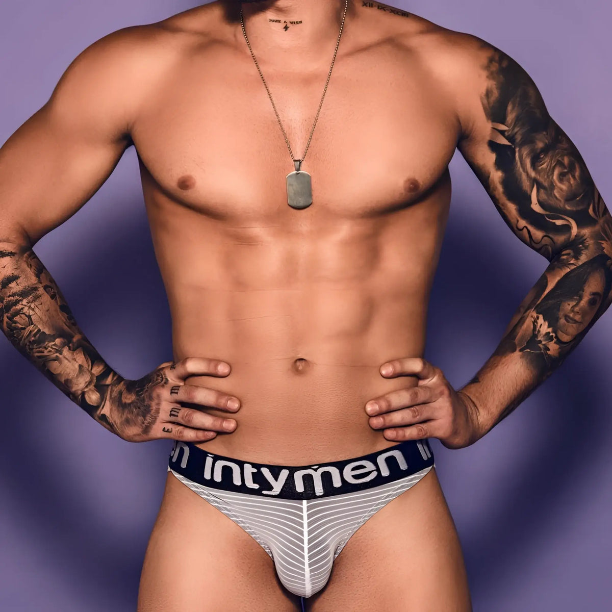 Intymen ini022 bikini brief in white and gray striped mesh with a black elastic waistband featuring intymen branding