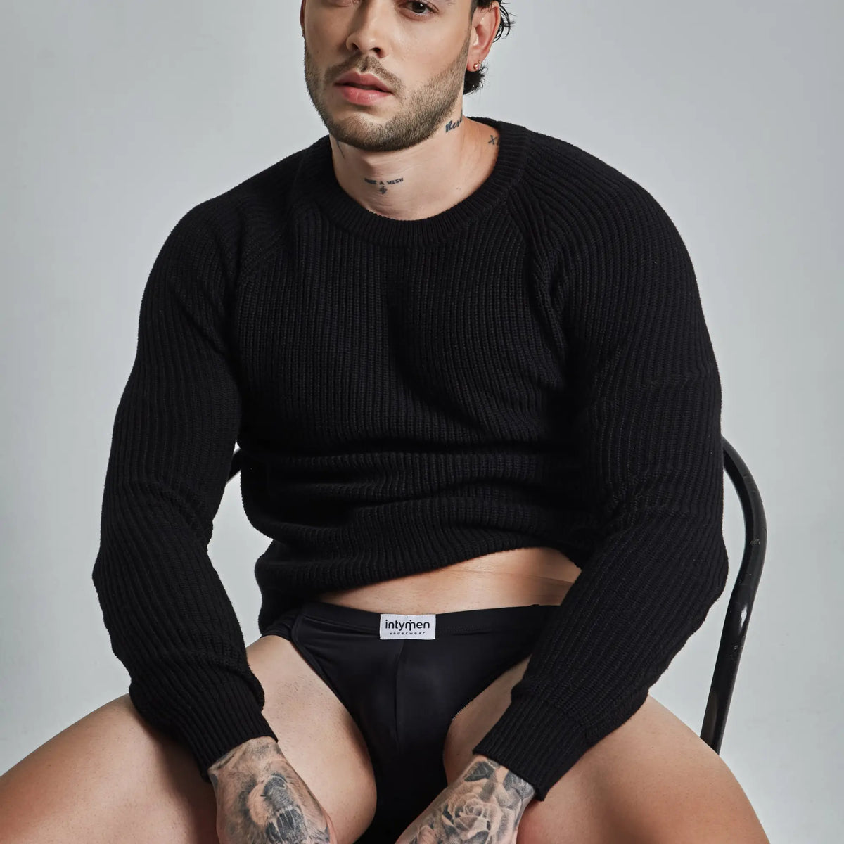 Black ribbed knit sweater by intymen inj098 brief showing the back side with a soft textured fabric
