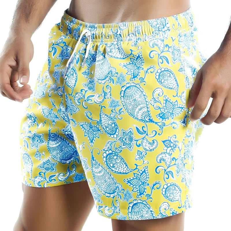 Bright yellow Intymen INO011 swim trunks with vibrant blue and white paisley pattern elastic waistband and drawstring