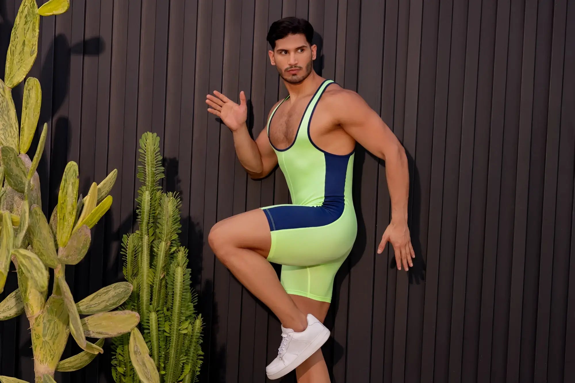 Neon green and navy blue sleek form-fitting JOR 2216 fighter bodysuit designed for athletic performance