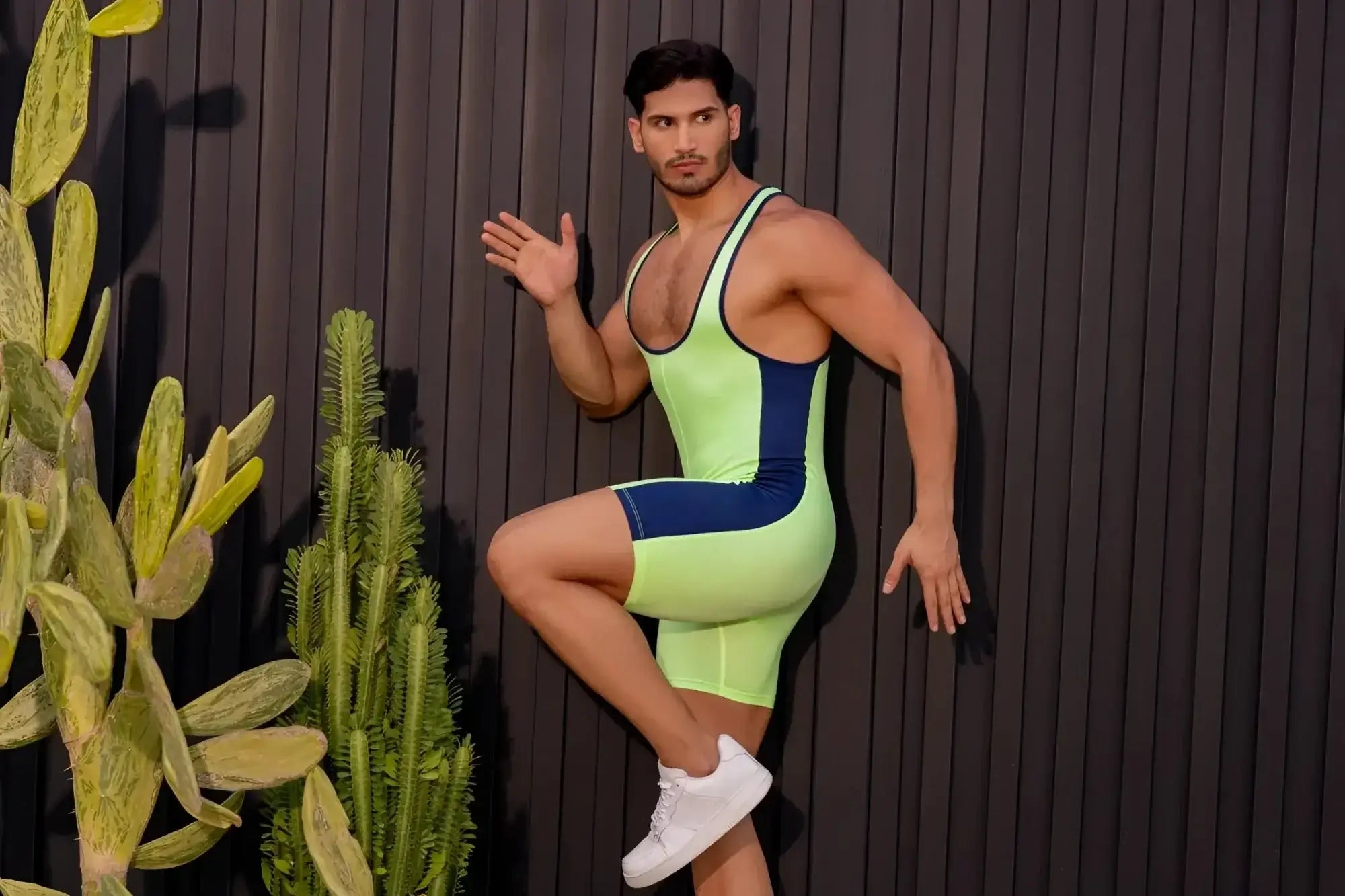 Neon green and navy blue sleek form-fitting JOR 2216 fighter bodysuit designed for athletic performance