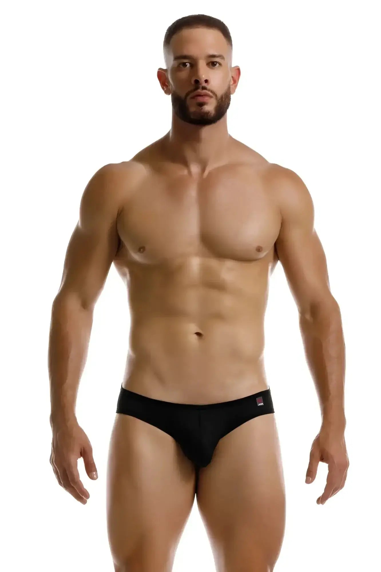 Black jor 2242 origin thongs with a small red and white logo on the waistband showing the front side