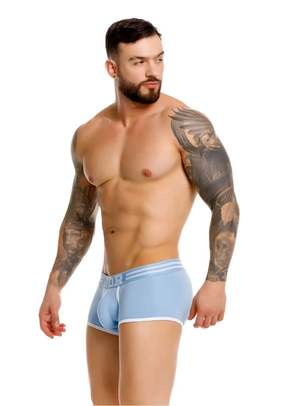 Model wearing blue JOR 2320 College Trunks. Side view.