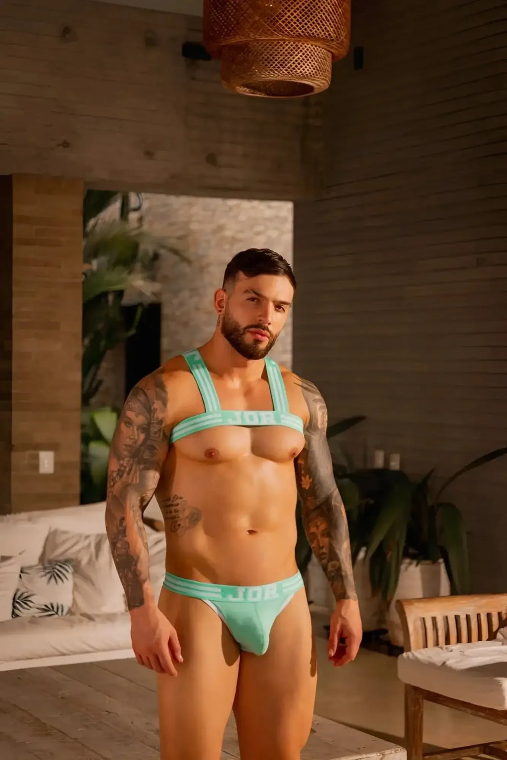 Lifestyle shot of a man wearing JOR 2323 College Thongs in mint color.