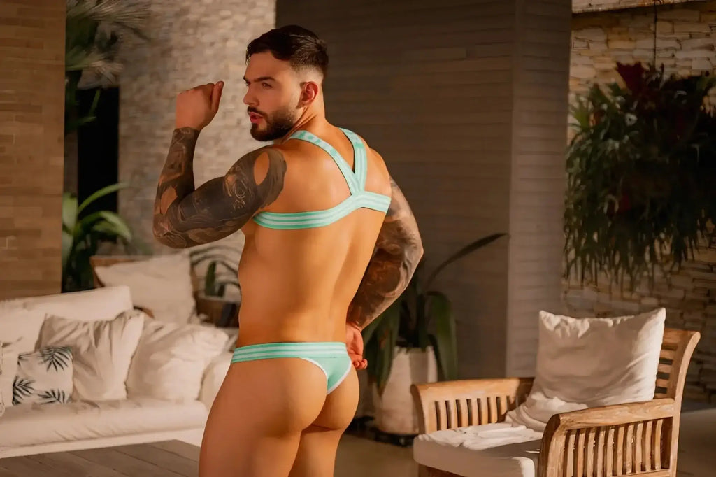 JOR 2323 College Thong in mint, back view lifestyle shot on a tattooed model.