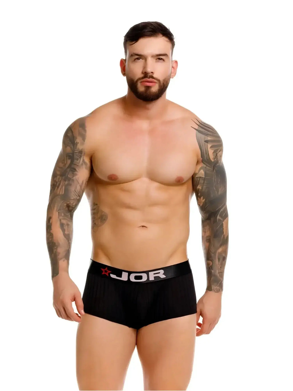 Front view of JOR 2330 Cronos trunks in black worn by a tattooed male model.