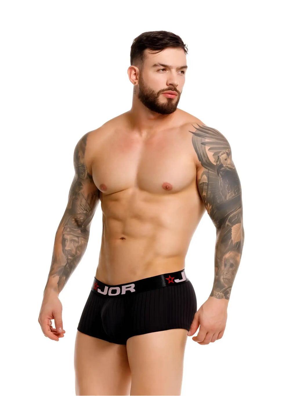 Man wearing black ribbed low-rise trunks with a black elastic waistband featuring the JOR logo and red star accents.